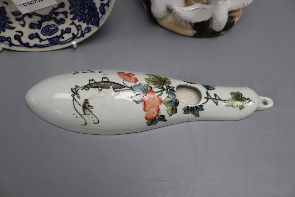 A Chinese blue and white dish, a wall pocket and a bird group, tallest 26cm
